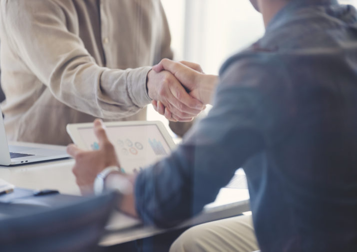 Close up of Businessmen shaking hands.